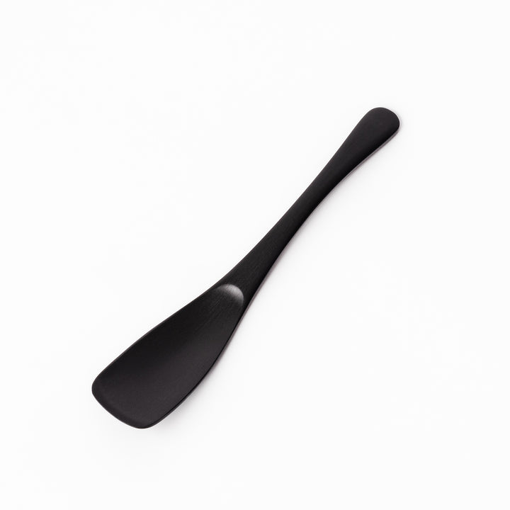 Matte black aluminum ice cream spoon with a flat-edged design, crafted for effortless scooping of firm frozen desserts straight from the freezer.