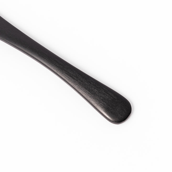 Matte black aluminum ice cream spoon with a flat-edged design, crafted for effortless scooping of firm frozen desserts straight from the freezer.