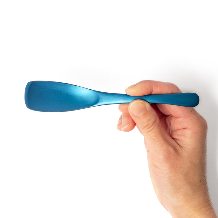 Blue aluminum ice cream spoon with a sleek matte finish and flat tip, designed for smoothly scooping even the hardest frozen treats.