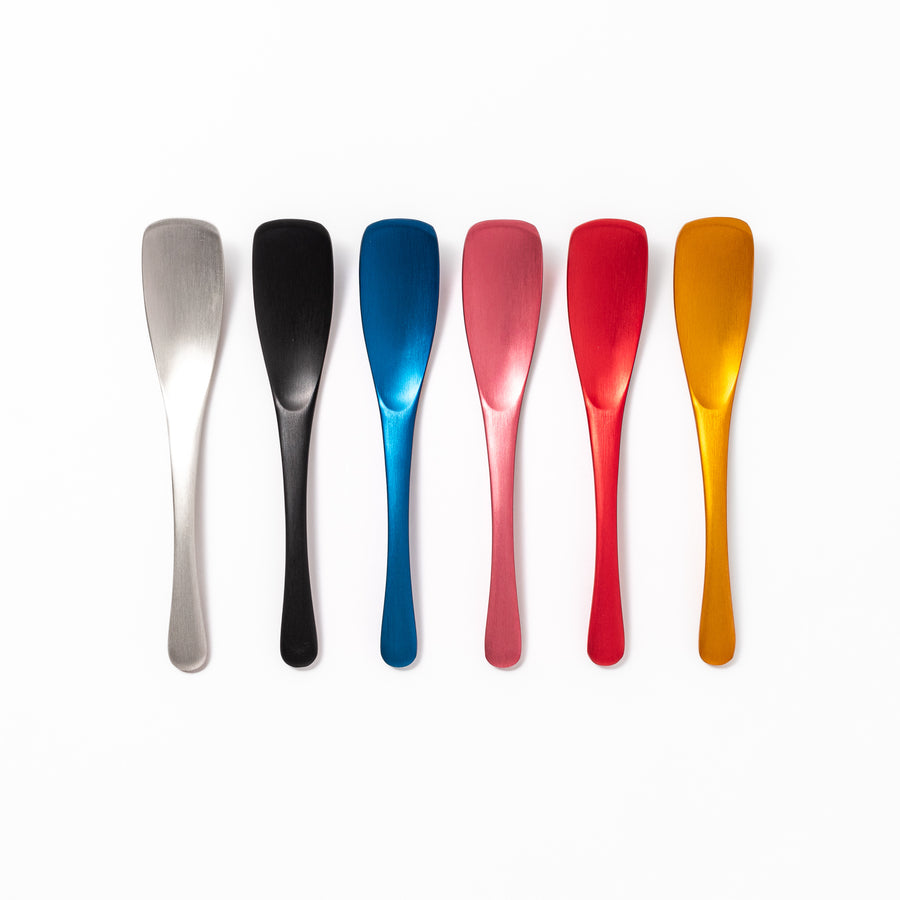 Set of six aluminum ice cream spoons in vibrant colors, designed for easy scooping and comfortable grip even with frozen desserts.