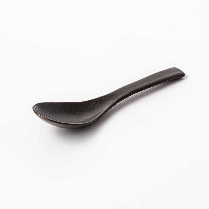 Black ceramic spoon with a smooth, rounded bowl and straight handle, ideal for serving soups, stews, or curry with refined simplicity.