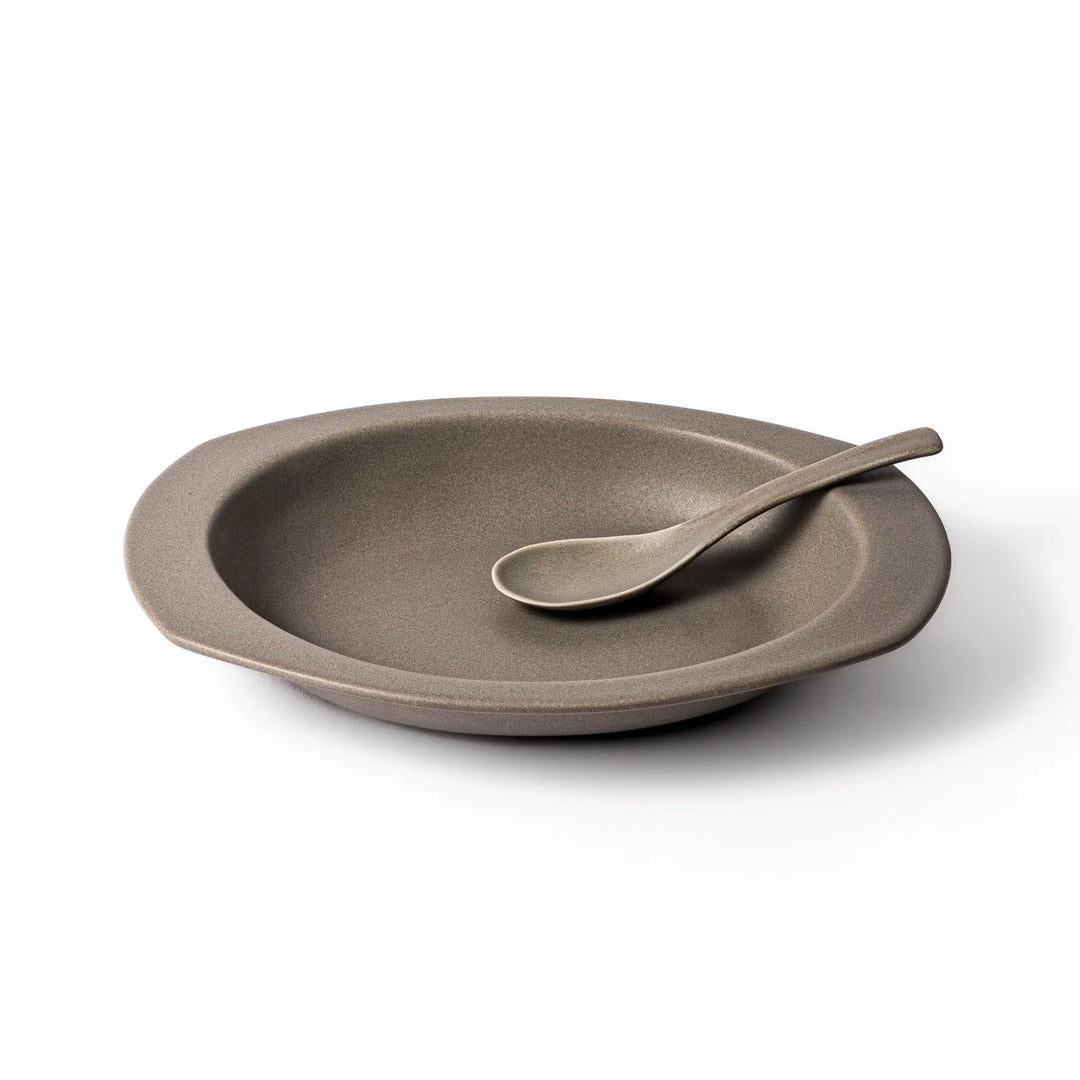 Gray oval ceramic curry plate with gently raised sides and wide rim, designed for easy scooping and serving rice, curry, or stew dishes.