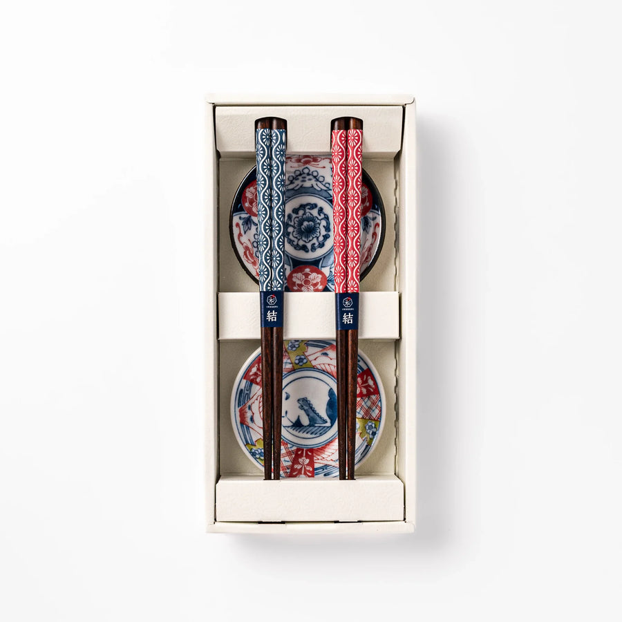 Japanese Edo-style chopsticks and sauce dish set featuring red and blue patterns with playful dinosaur motif gift box.
