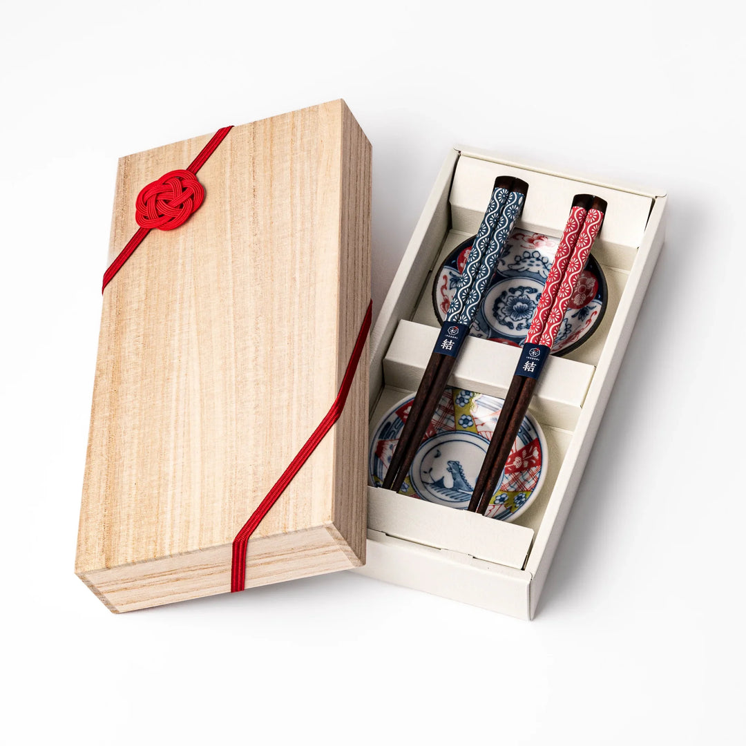 Japanese Edo-style chopsticks and sauce dish set featuring red and blue patterns with playful dinosaur motif gift box.