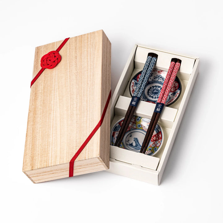 Japanese Edo-style chopsticks and sauce dish set featuring red and blue patterns with playful dinosaur motif gift box.