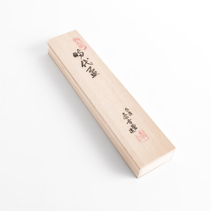 Elegant wooden box with a sleek design, holding five traditional sake cups with intricate patterns, showcasing Japanese craftsmanship and style.