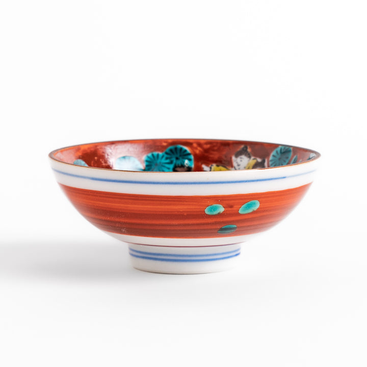 Sake cup with a vivid depiction of a historical scene, featuring figures gathered around a fire, set against a colorful, intricate background.