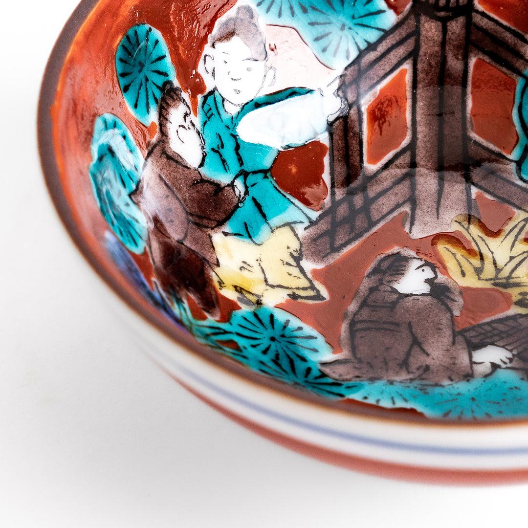 Sake cup with a vivid depiction of a historical scene, featuring figures gathered around a fire, set against a colorful, intricate background.