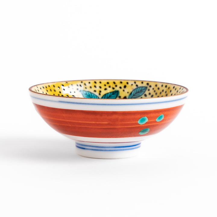 Sake cup featuring a bright yellow background with bold blue and brown flowers, creating a striking and vibrant floral pattern in traditional Japanese style