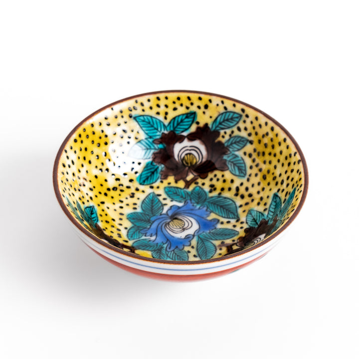 Sake cup featuring a bright yellow background with bold blue and brown flowers, creating a striking and vibrant floral pattern in traditional Japanese style