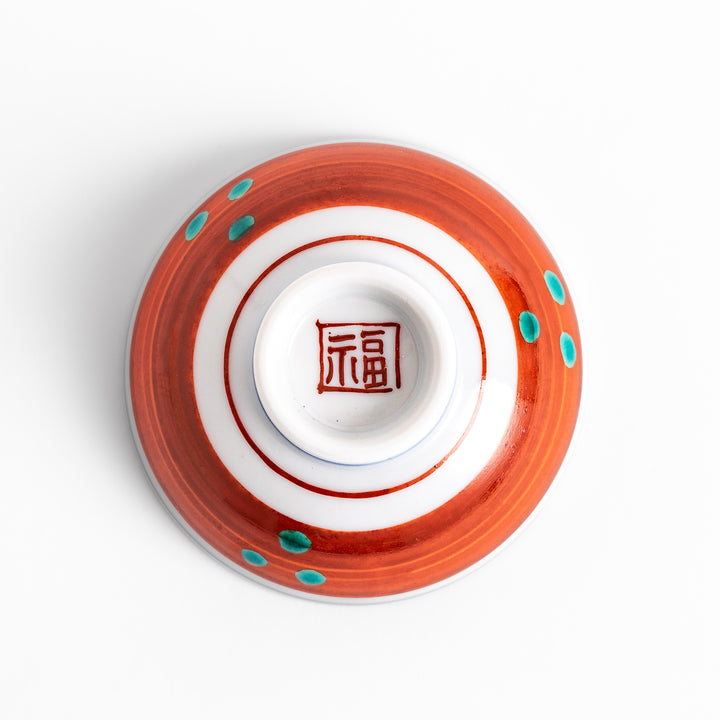 Sake cup featuring a bright yellow background with bold blue and brown flowers, creating a striking and vibrant floral pattern in traditional Japanese style