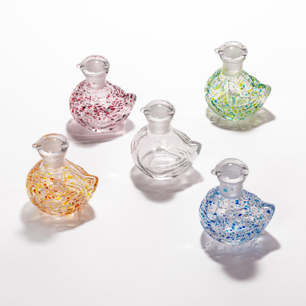 Charming Ethereal Songbird soy sauce dispenser set with colorful speckled designs, perfect for adding a whimsical touch to your dining table.