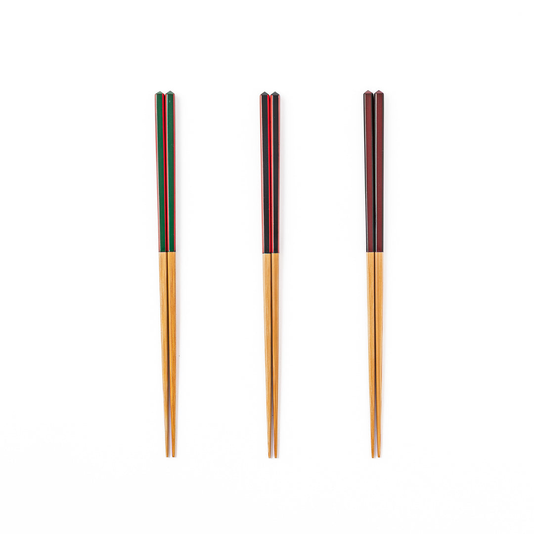Fine tip Japanese bamboo chopsticks in green black and wine red with vibrant stripes and a natural bamboo finish