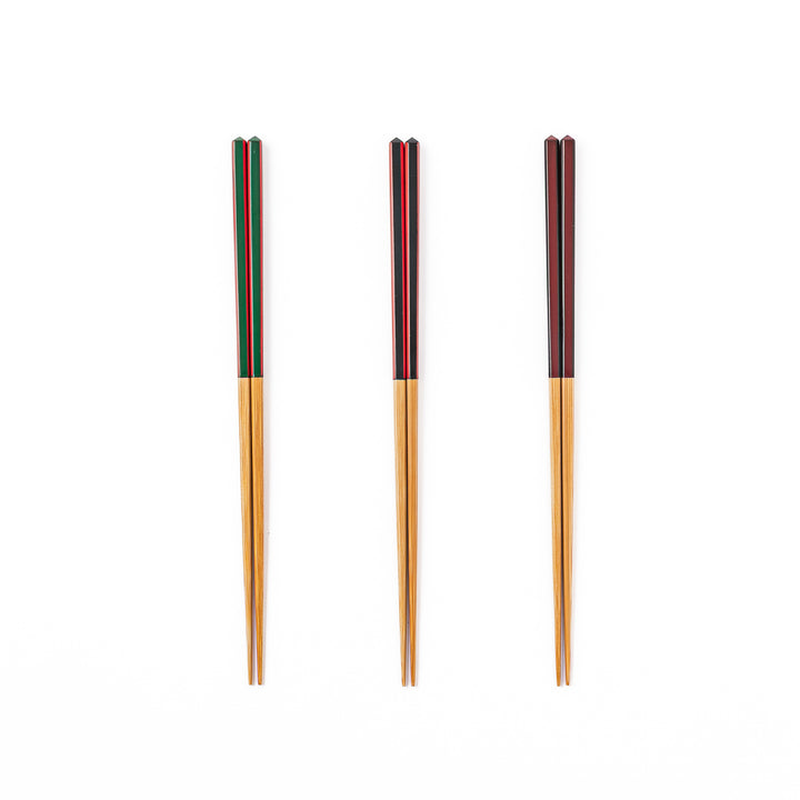 Fine tip Japanese bamboo chopsticks in green black and wine red with vibrant stripes and a natural bamboo finish