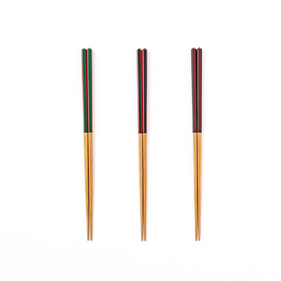 Fine tip Japanese bamboo chopsticks in green black and wine red with vibrant stripes and a natural bamboo finish