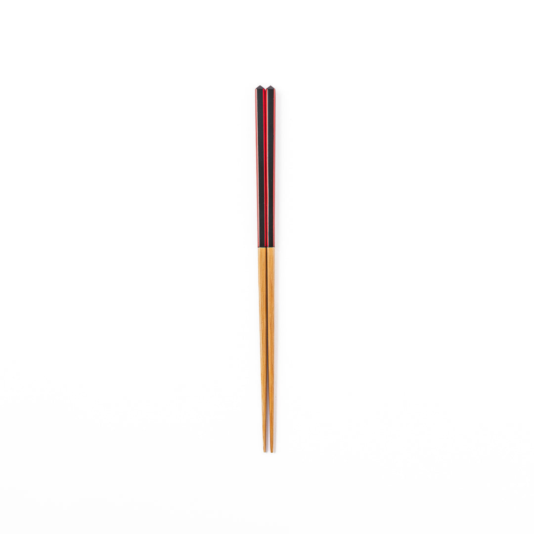 Fine tip Japanese bamboo chopsticks featuring a black handle with bold red side stripes and a natural bamboo finish
