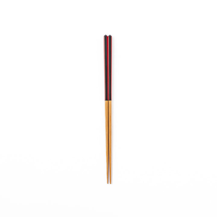 Fine tip Japanese bamboo chopsticks featuring a black handle with bold red side stripes and a natural bamboo finish