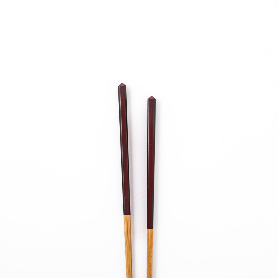 Fine tip Japanese bamboo chopsticks featuring a wine red handle with dark side stripes and a natural bamboo finish