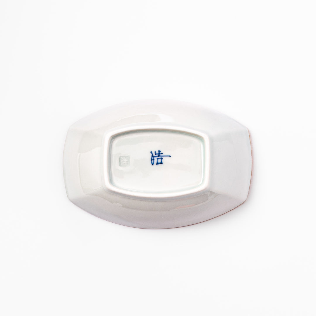 White boat-shaped bowl with blue floral patterns on the inner rim and a rustic brown edge, perfect for cereal or side dishes.