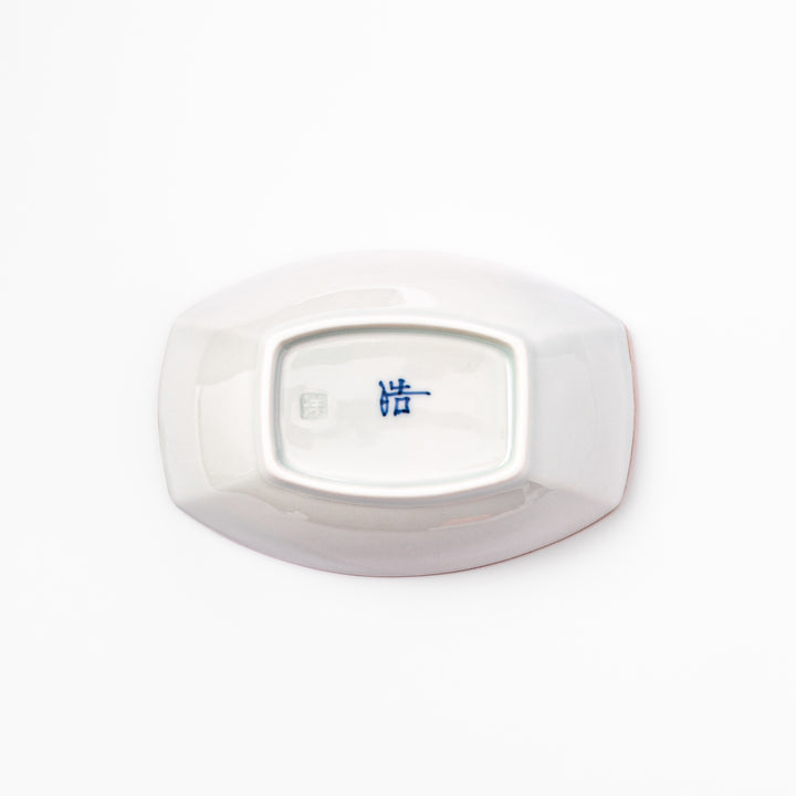 White boat-shaped bowl with blue floral patterns on the inner rim and a rustic brown edge, perfect for cereal or side dishes.