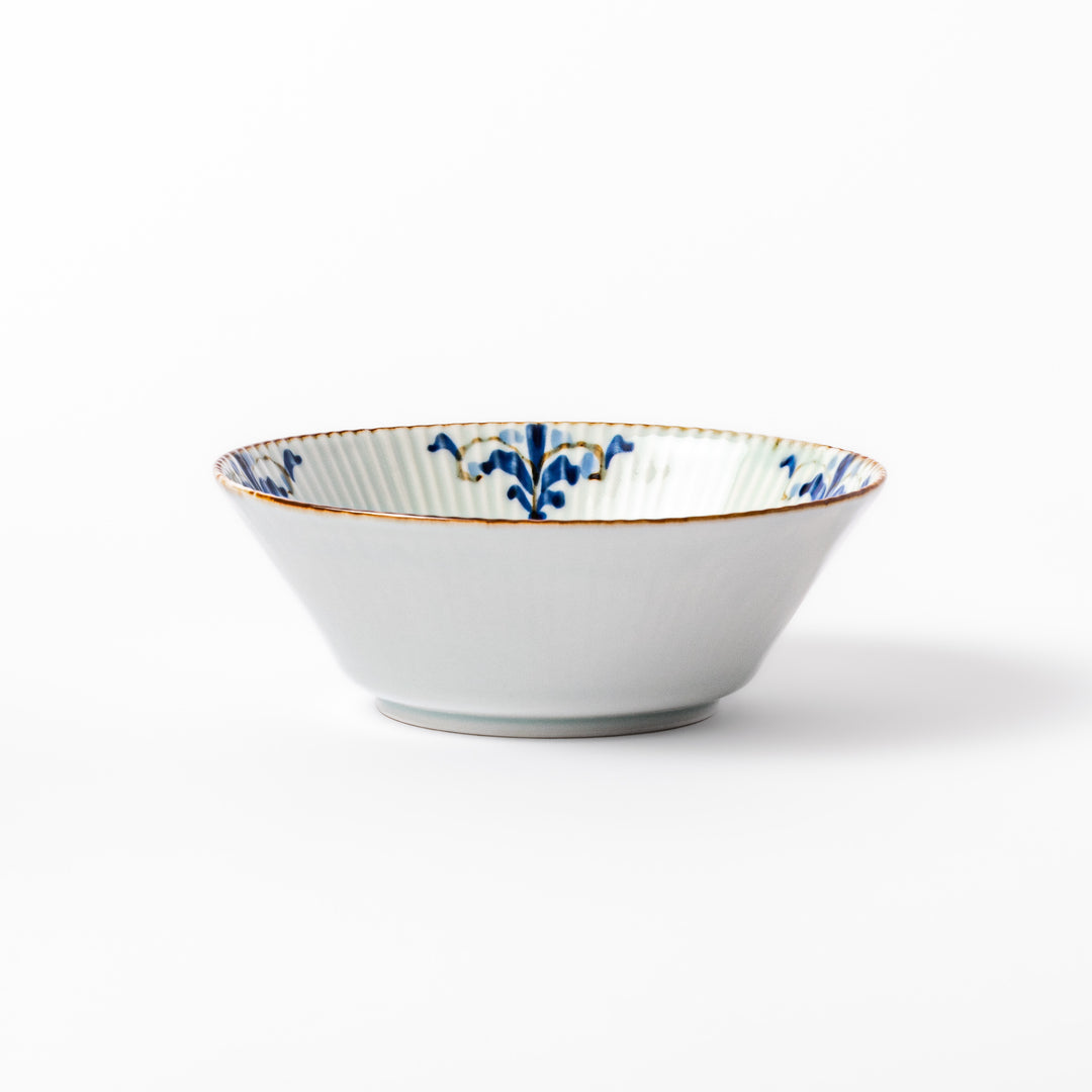 Ridged white bowl with blue floral designs around the inner rim and a brown edge, perfect for cereal, soup, or salad. 