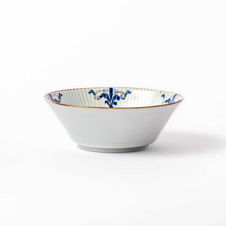 Ridged white bowl with blue floral designs around the inner rim and a brown edge, perfect for cereal, soup, or salad. 