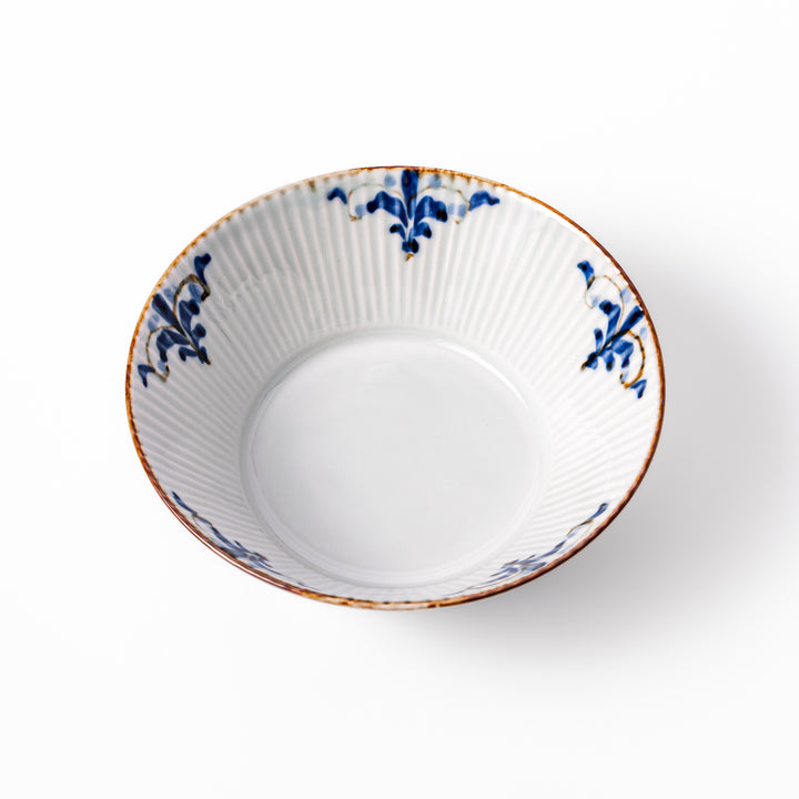 Ridged white bowl with blue floral designs around the inner rim and a brown edge, perfect for cereal, soup, or salad. 