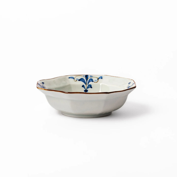 Arita porcelain octagonal cereal bowl with blue floral leaf pattern and gold rim, ideal for rice or soup.