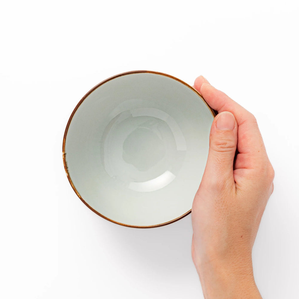 Arita porcelain rice bowl with blue floral leaf motif and gold rim, perfect for serving rice or soup.