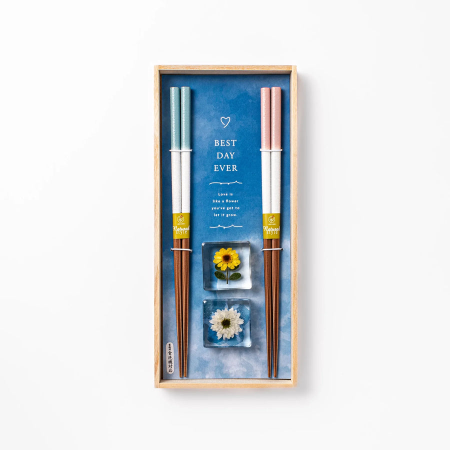Floral-themed Japanese chopsticks gift set with pastel handles and clear rests featuring pressed sunflower and daisy.