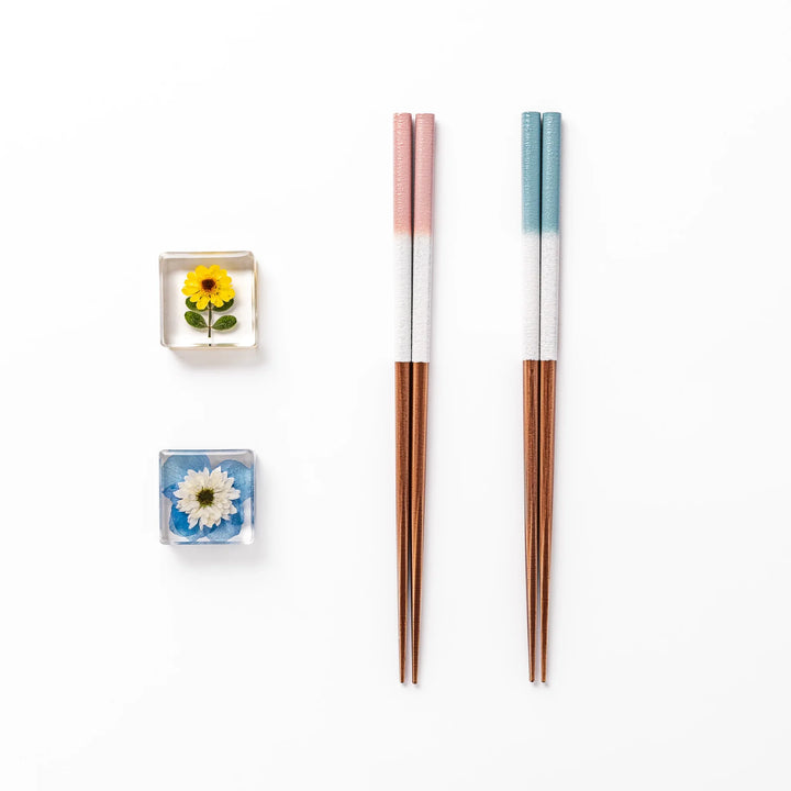 Floral-themed Japanese chopsticks gift set with pastel handles and clear rests featuring pressed sunflower and daisy.