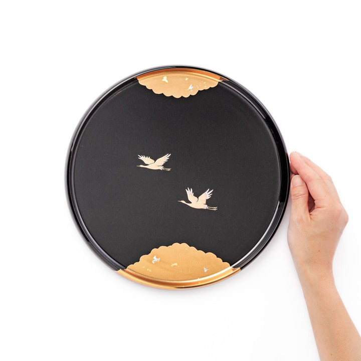 Flying Crane Japanese serving tray with black lacquer base and gold crane and cloud motif for elegant tea.