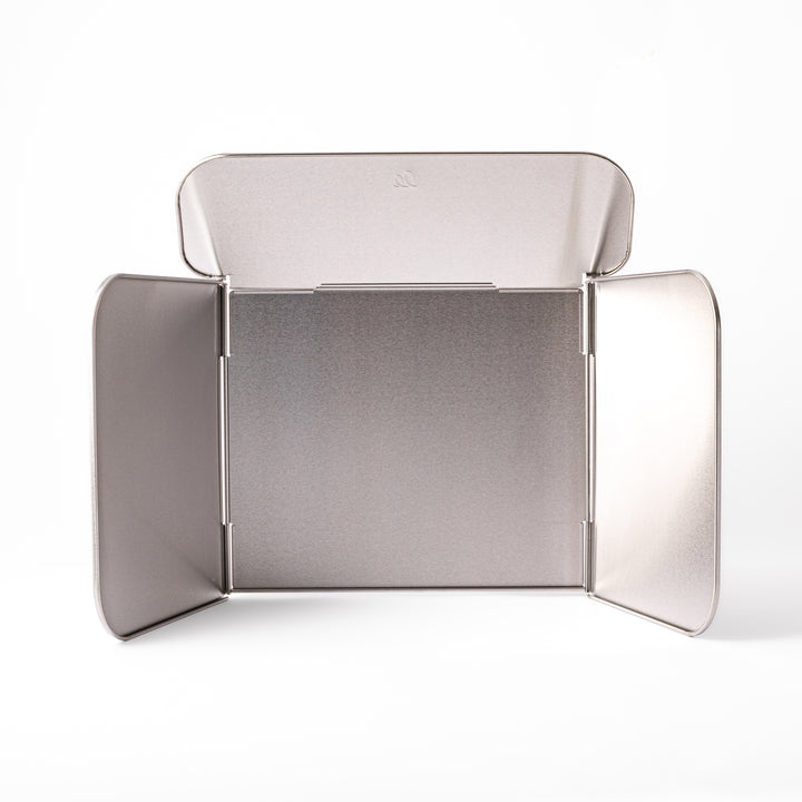 Japanese Foldable Stainless Steel Stove Splatter Guard fully assembled and standing on a white background