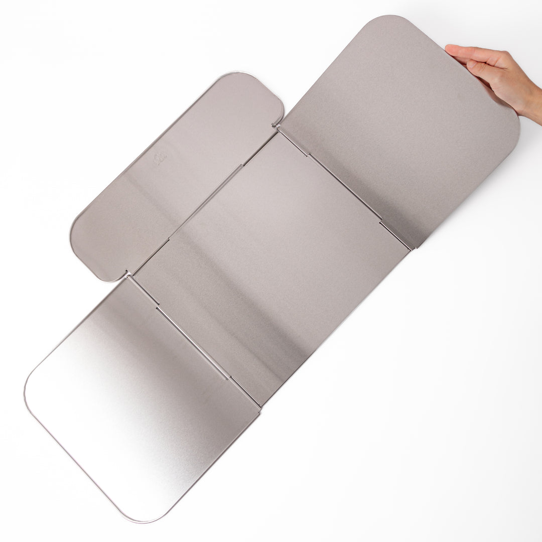 Japanese Foldable Stainless Steel Stove Splatter Guard fully assembled and standing on a white background