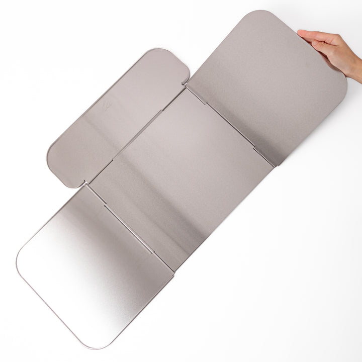 Japanese Foldable Stainless Steel Stove Splatter Guard fully assembled and standing on a white background