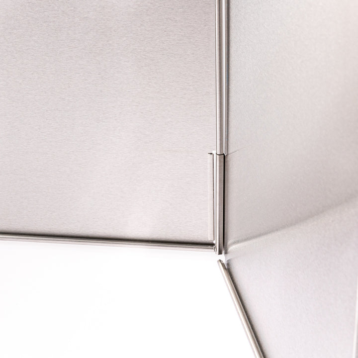 Japanese Foldable Stainless Steel Stove Splatter Guard fully assembled and standing on a white background