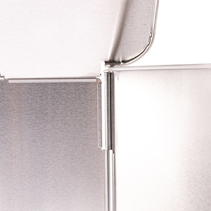 Japanese Foldable Stainless Steel Stove Splatter Guard fully assembled and standing on a white background