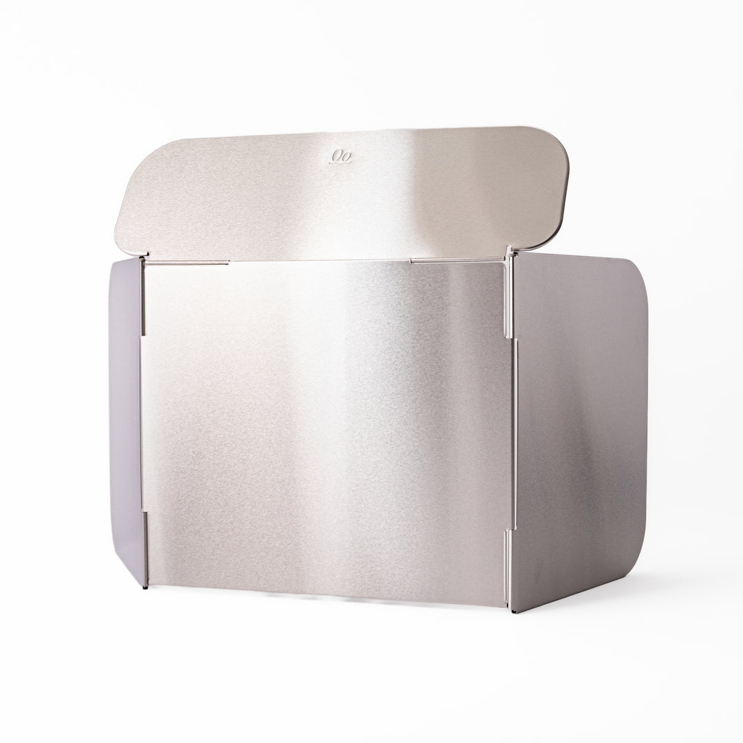 Japanese Foldable Stainless Steel Stove Splatter Guard fully assembled and standing on a white background