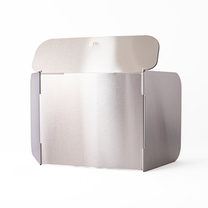 Japanese Foldable Stainless Steel Stove Splatter Guard fully assembled and standing on a white background
