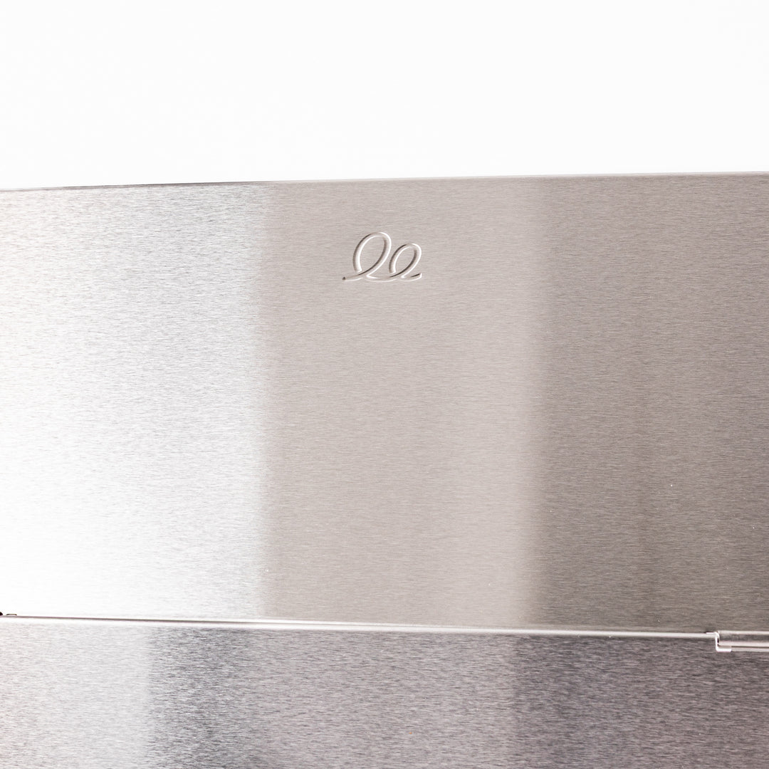 Japanese Foldable Stainless Steel Stove Splatter Guard fully assembled and standing on a white background