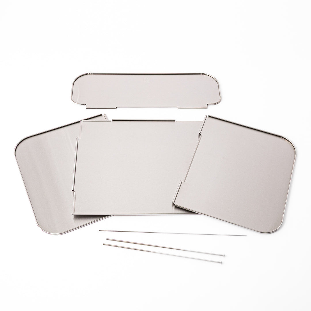 Japanese Foldable Stainless Steel Stove Splatter Guard disassembled into panels and connecting pins on white background