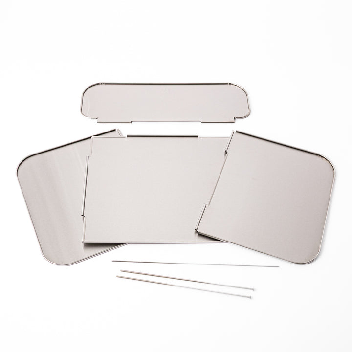 Japanese Foldable Stainless Steel Stove Splatter Guard disassembled into panels and connecting pins on white background