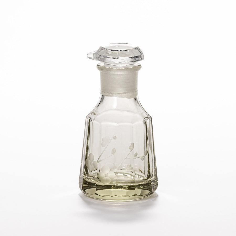 Elegant soy sauce dispenser with a frosted plum blossom design, featuring a smooth pour spout and an intricate geometric base. 