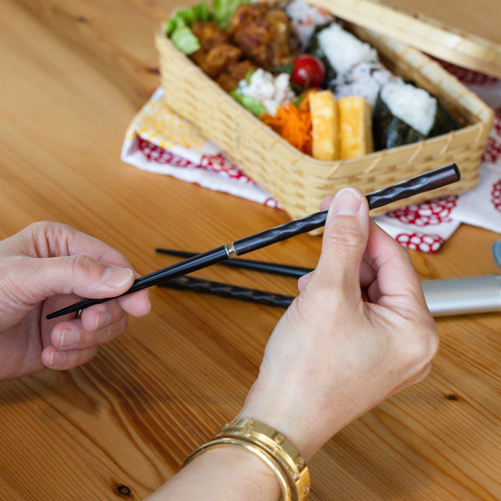 Nami from Just One Cookbook assembling gentle wave Japanese travel chopsticks with a textured screw on handle