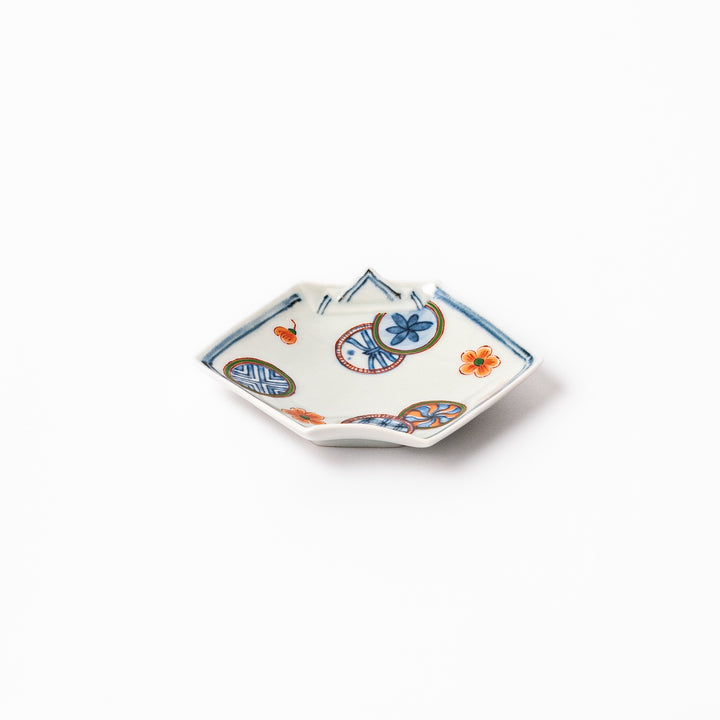 Japanese porcelain origami-shaped sauce dish with geometric circle and floral motifs, handcrafted in Japan for soy sauce, condiments, or appetizers