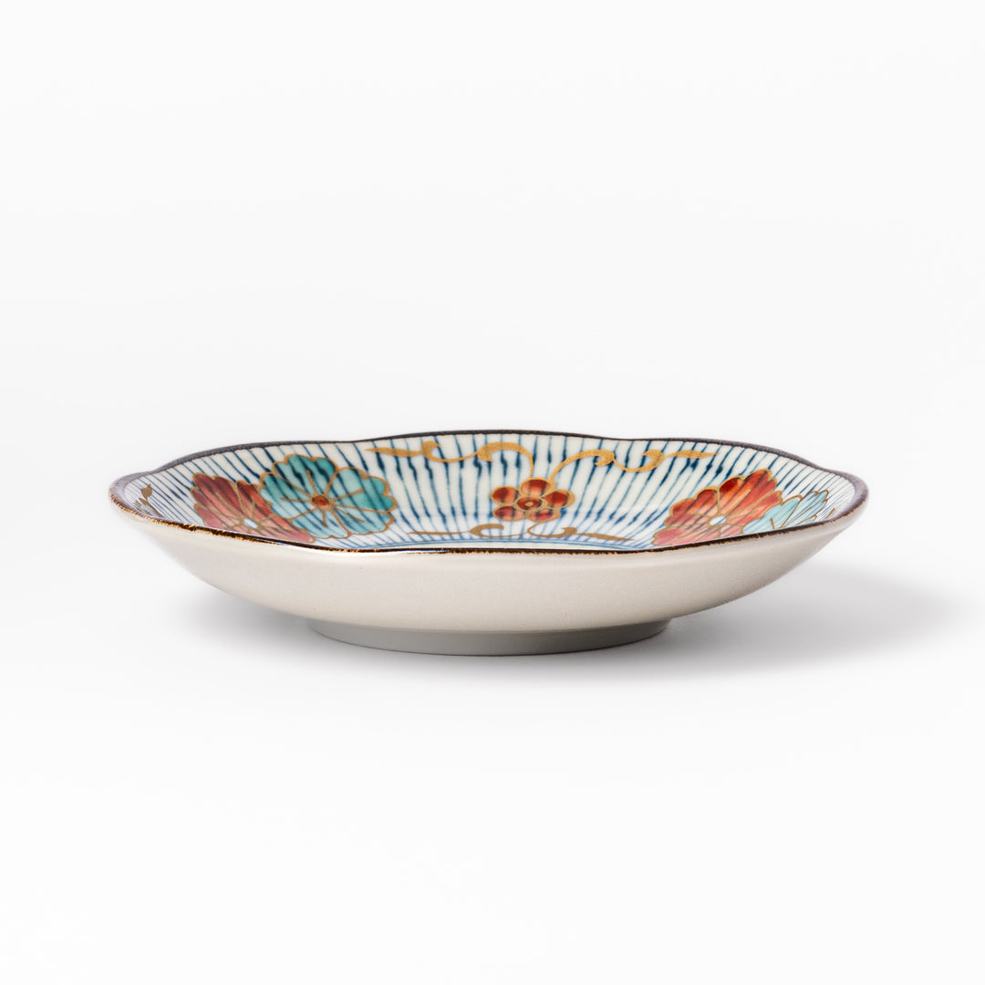 Scalloped edge Japanese sauce dish with vertical blue stripes and red, teal, and gold floral motifs, ideal for serving condiments with elegance.