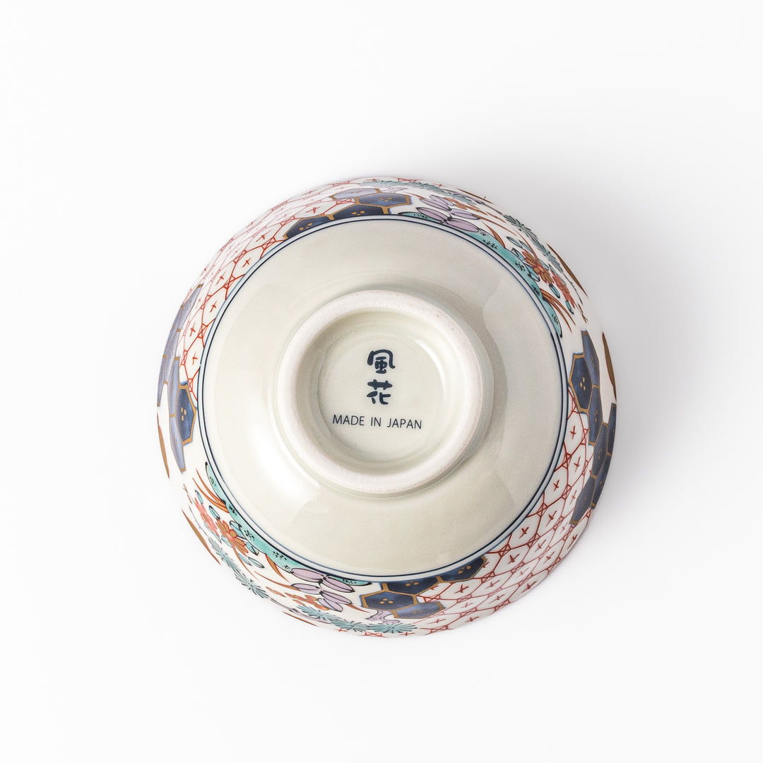 Traditional Japanese rice bowl featuring red lattice, navy hexagons, and multicolor floral motifs, perfect for adding elegance to everyday meals.