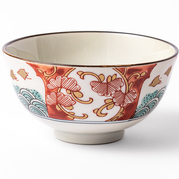 Traditional Japanese rice bowl featuring red, green, and gold motifs with waves, florals, and flying birds—perfect for refined, elegant dining.