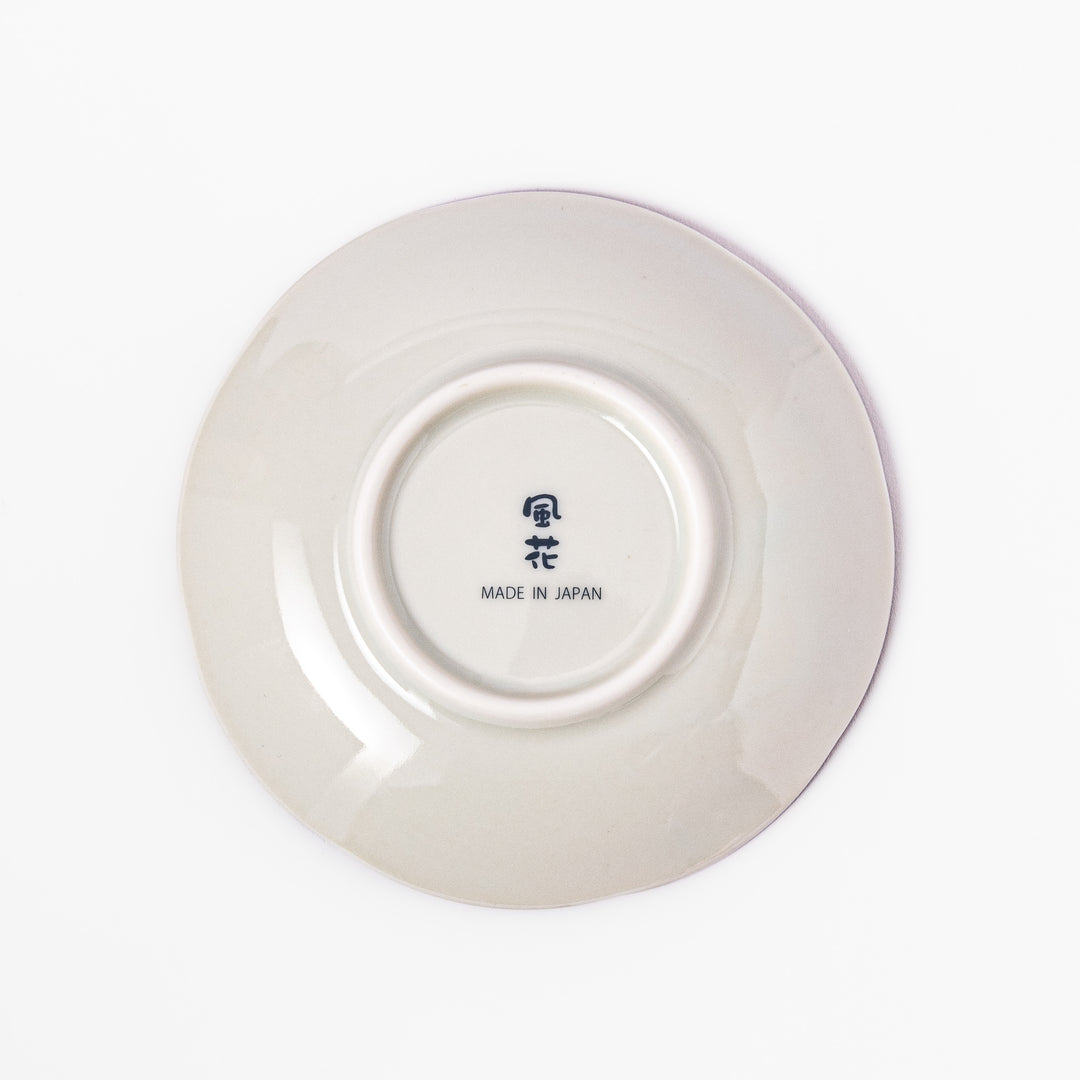 Scalloped edge sauce dish featuring red, blue, and green traditional Japanese motifs with a floral center, perfect for elegant table presentations.