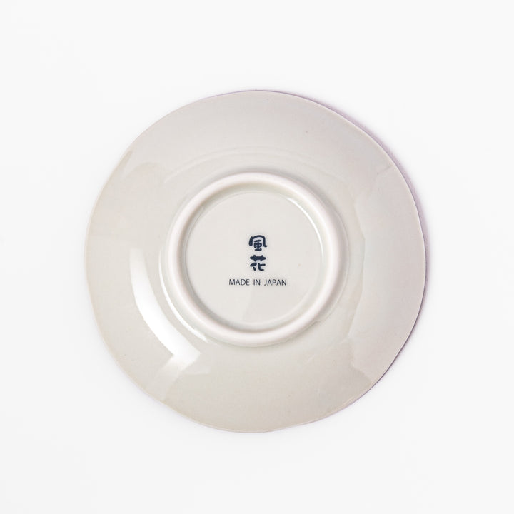 Scalloped edge sauce dish featuring red, blue, and green traditional Japanese motifs with a floral center, perfect for elegant table presentations.